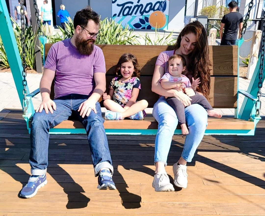 Family sitting on a swing
