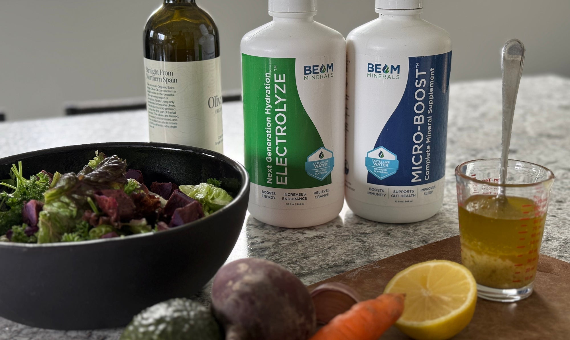 BEAM Minerals and Electrolyze on counter top with salad