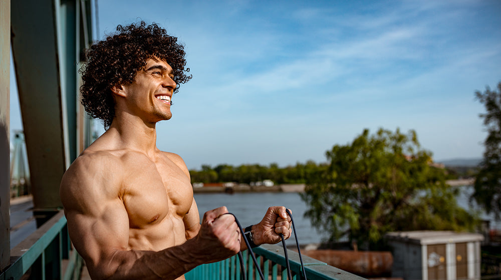 statue of delicate woman and pink flowers