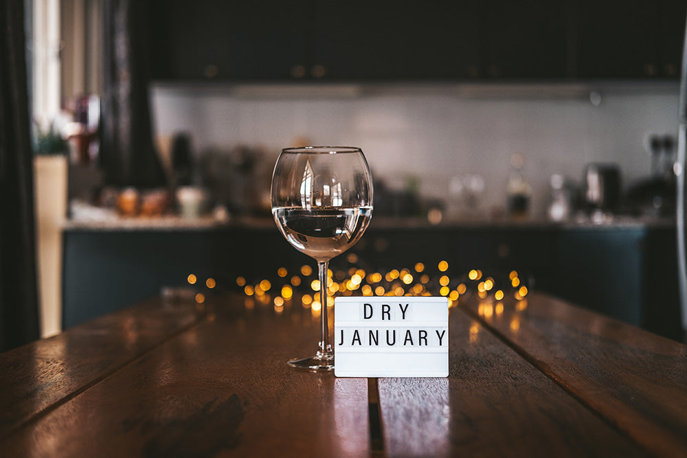 glass of water with sign that says Dry January