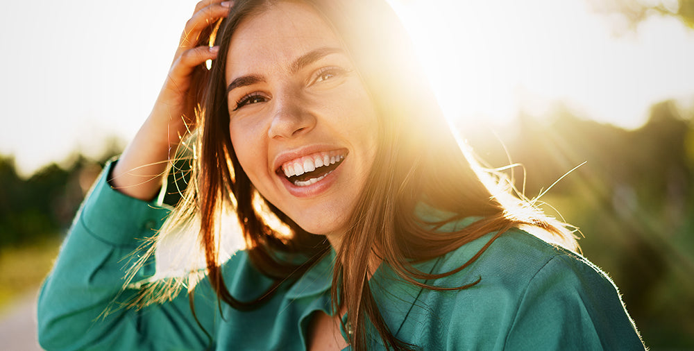 woman smiling in sunshine