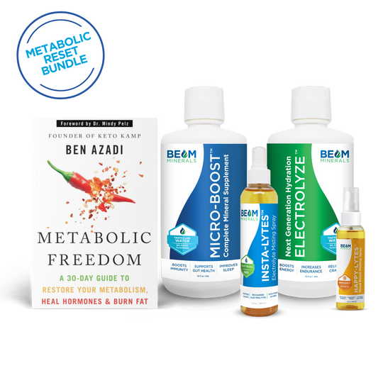 Metabolic reset bundle with Advanced Set bottles and a book on a white background